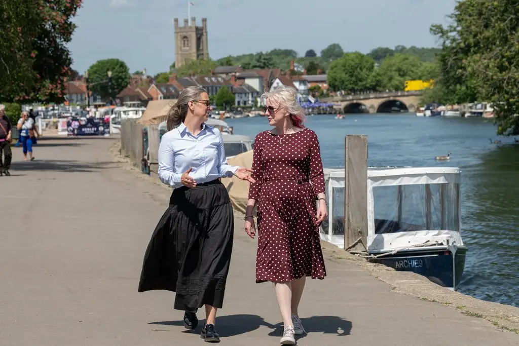 2 ladies walking by the river